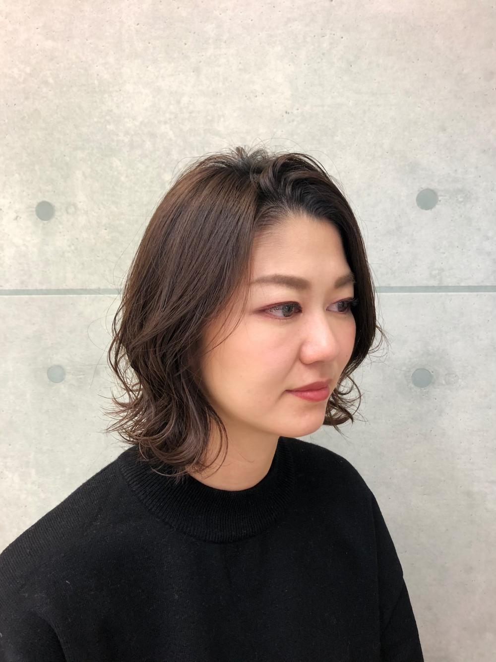 外ハネかきあげバング